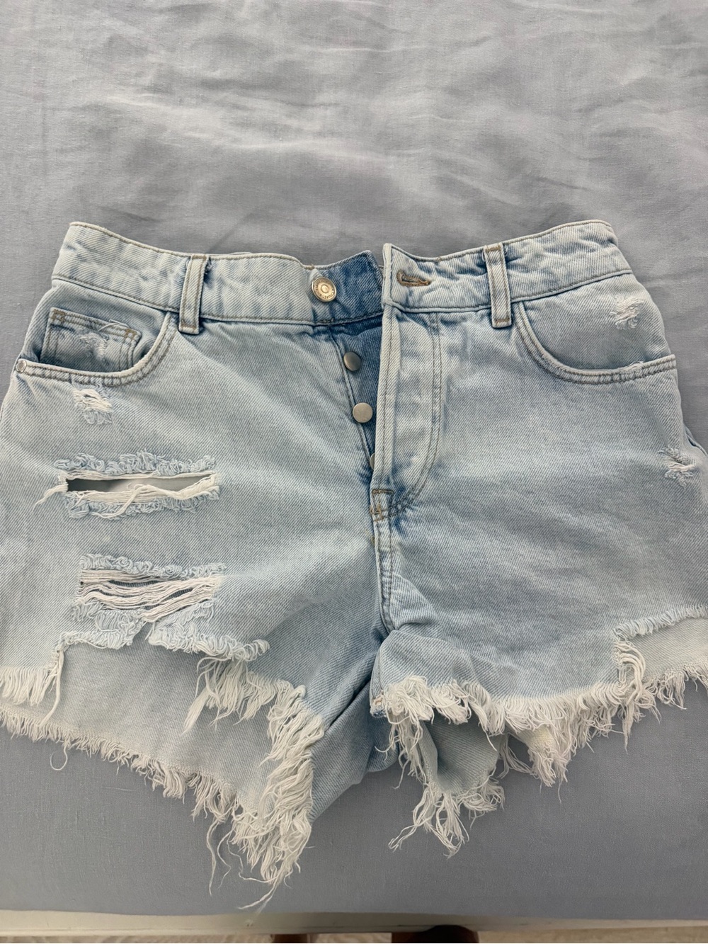 Zara women’s High-Waist Light Blue Distressed Denim Shorts
